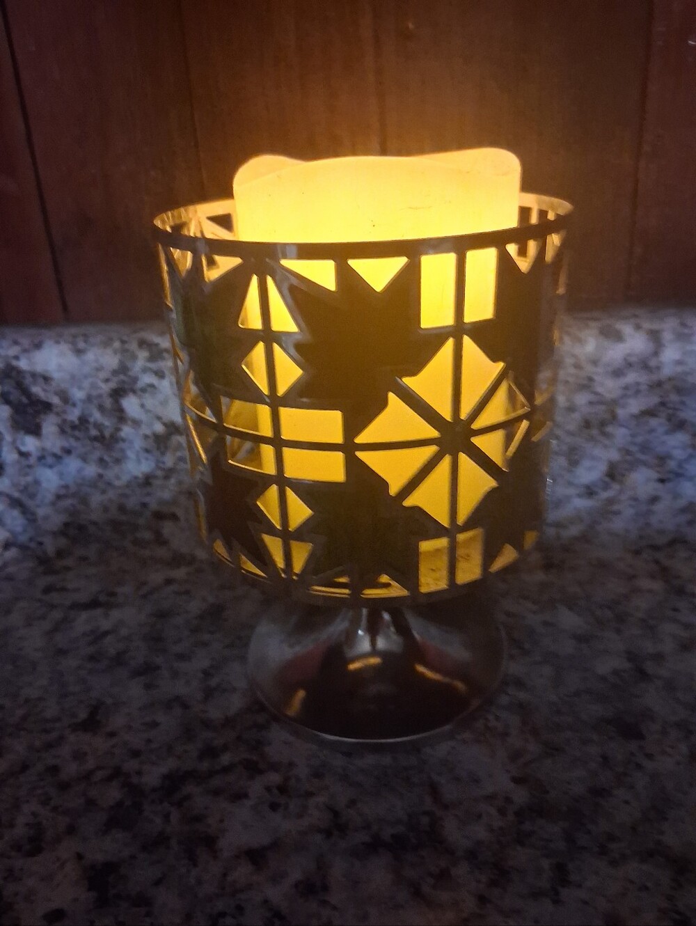 Metal Cutout Candle Holder with Warm Yellow Glow